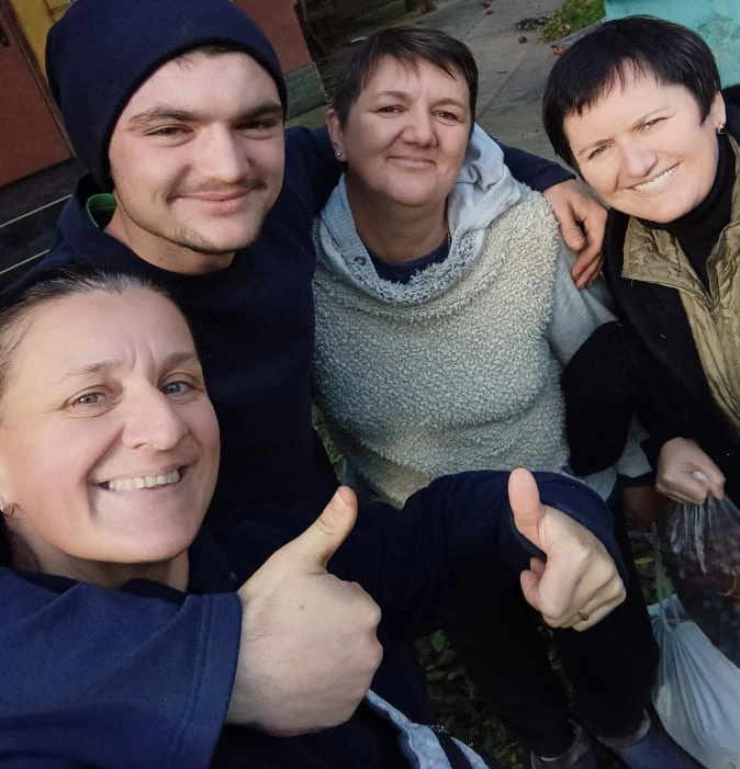 people hug and smile